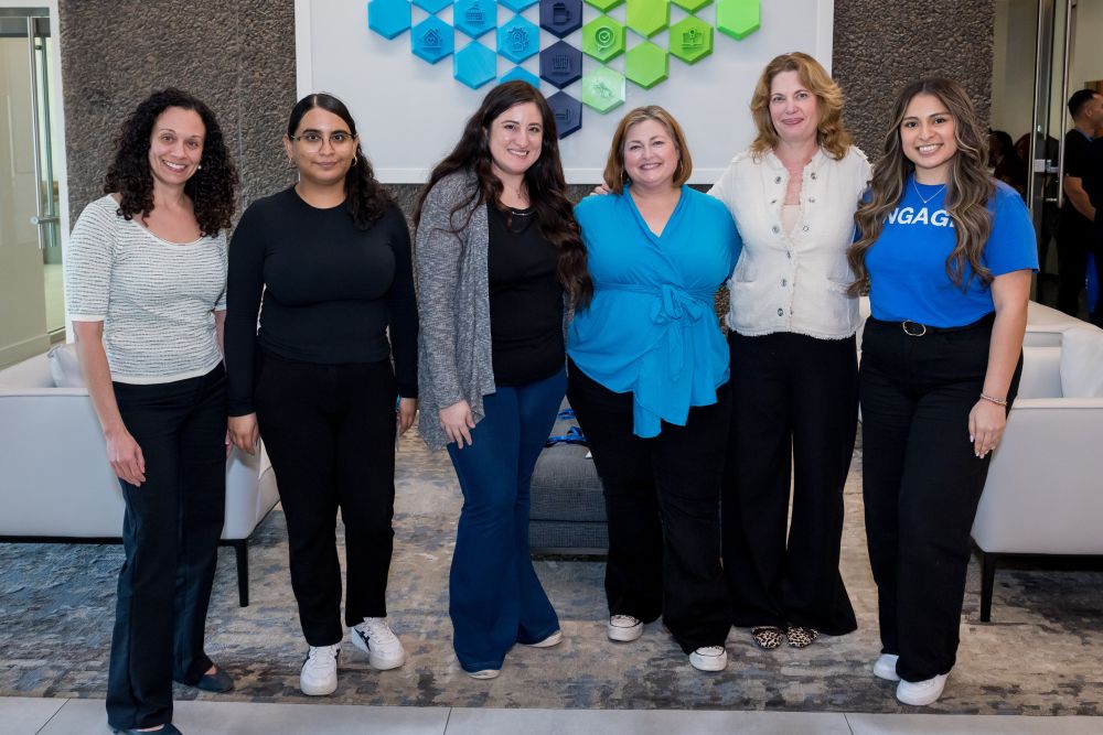 6 women stand together outside lecture hall at UT Southwestern