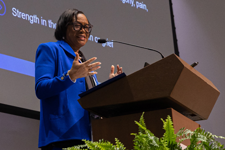 woman speaking at a podium