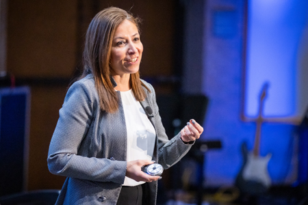 woman presenting on stage