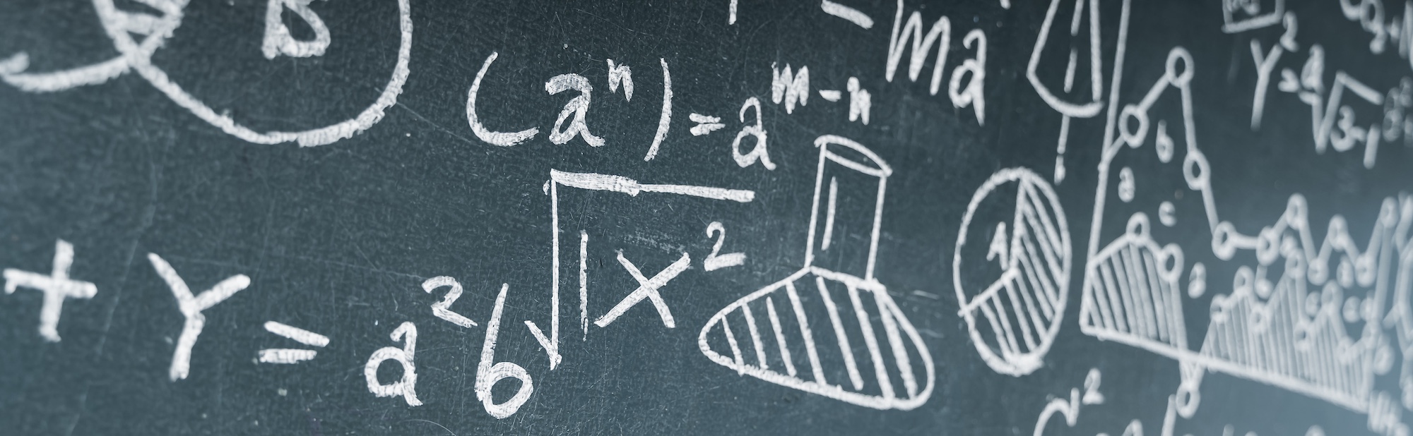 Blackboard filled with scientific formulas, DNA strands, and chemistry symbols