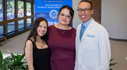 Dr. Salazar stands with his daughter, Gabby Salazar (left), and his wife, Leticia Salazar, outside Gooch Auditorium.