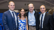 From left: Dr. Hendren and his wife, Sarah Hendren, are all smiles as they pose with Vlad Zaha, M.D., Ph.D., Associate Professor of Internal Medicine in the Division of Cardiology, and Amit Khera, M.D., Professor of Internal Medicine, Clinical Chief of Cardiology and Director of the Preventive Cardiology Program.