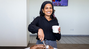 At the Institutional Advancement ceremony, Archana Nilaweera with Communications, Marketing, and Public Affairs (CMPA) serves up chocolate ice cream and smiles.