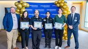 Holding their certificates, these Gold pin recipients from the Business Affairs ceremony stand proud, from left: Genesis Meneses of Auxiliary Enterprises Administration, Michael Cantu formerly with Parking Services, Celene Chabolla in Parking Services, and Emily Hryekewicz from Printing Services. Beside them are Justin Arrington, Director of Auxiliary Enterprises, left, and Matt Rosamond, M.B.A., Vice President for Finance and Chief Financial Officer.