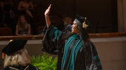Alexius Pratt, M.D., waves to her family as she crosses the stage.