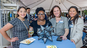 From left, Isaura Davis, Brittany Jackson, Jodi England-Trevino, and Melissa Sotelo, colleagues in Human Resources, visit and enjoy food and refreshments at the reception.