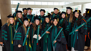Diplomas in hand, joyful graduates get into the spirit of their momentous achievement.