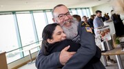 Smiles and hugs aplenty as employees celebrate Gold and Platinum pin recipients during the Academic Affairs ceremony