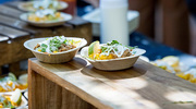 Tasty food items at the reception included brisket elote corn bowls.