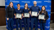 Employees representing the large number of 2 Orange (Surgical Intensive Care Unit) recipients show off their Platinum PACT certificates.