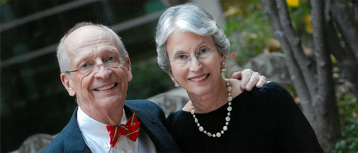 Smiling man and woman posing together.
