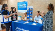 Employees connect and talk with representatives of UT Southwestern’s School of Health Professions.