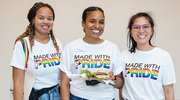 UTSW employees, wearing their Pride T-shirts, enjoy the celebration.