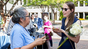 Ms. Gemmell chats with a UTSW colleague.