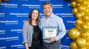 At the Business Affairs event, Gold pin recipient Marcus Mexia from Human Resources Talent Acquisition holds his certificate beside Leslie Phillips, Associate Vice President of Talent Acquisition.