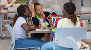 Guests and their families enjoy fun table games.