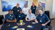 Facilities Management team members mingle at the Business Affairs ceremony.