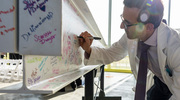 Benjamin Levi, M.D., Director of the Charles and Jane Pak Center for Mineral Metabolism and Clinical Research and Professor of Surgery, Plastic Surgery, and in Children’s Medical Center Research Institute at UT Southwestern, signs a beam at the topping out event.