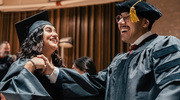Master of Physician Assistant Studies graduate Valeria Alvarez celebrates with Doctor of Physical Therapy graduate Geovani Zapata-Ramirez.