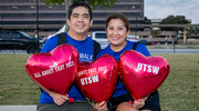 Two walkers bring customized balloons for their Heart Walk teammates.