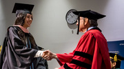 Alondra Olmos, M.P.H., receives her diploma from UT Southwestern President Daniel K. Podolsky, M.D.