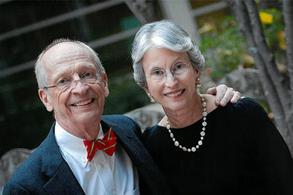 Smiling man and woman posing together.