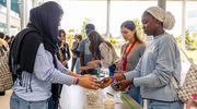 Harmony Science Academy student Zaahirat Odebode, right, exchanges a jar of slime with a classmate to see how it reacts differently.
