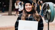 Doctor of Physical Therapy graduate Nguyen Le Quynh Pham proudly shows off her new diploma.