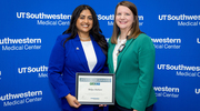Platinum pin recipient Shilpa Mathew with Harold C. Simmons Comprehensive Cancer Center Patient Access, left, shares a photo with her manager, Rebecca Stephens, Director of Oncology Business Services, at the Health System Affairs celebration.