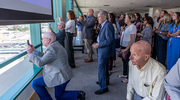 Dr. Podolsky and other UTSW executives, employees, and supporters watch the topping out progress from North Campus.