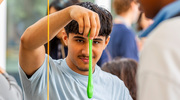 Mr. Hashimi drops slime to the ground for 20 seconds to see if any changes occur. This exercise helps students visualize how ECM-rich tissues like tendons behave when stretched.