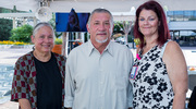 Mr.&nbsp;Flores spends time at the reception with his wife, Miriam, left, and Amanda Brophy, one of his supervisors.