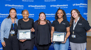 Platinum pin recipients holding their certificates alongside department managers include Ms. Robinson, second from left, and Monica Evans from the Animal Resource Center. From left, the managers are Ms. Lynn; Franklyn Howell, Manager of Animal Care; and Courtney Nesline, Assistant Director of Animal Care.
