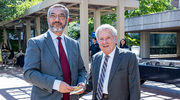 Enjoying the awards reception on McDermott Plaza are Mr.&nbsp;Guerra, left, and Ruben Esquivel,&nbsp;M.B.A., Vice President for Community and Corporate Relations.