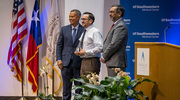 Mr.&nbsp;Lopez graciously accepts his Pinnacle Award for Excellence, followed by a photo on stage with Dr.&nbsp;Nivet, left, and Juan Guerra Jr.,&nbsp;M.B.A., M.Eng., Vice President for Facilities Management.