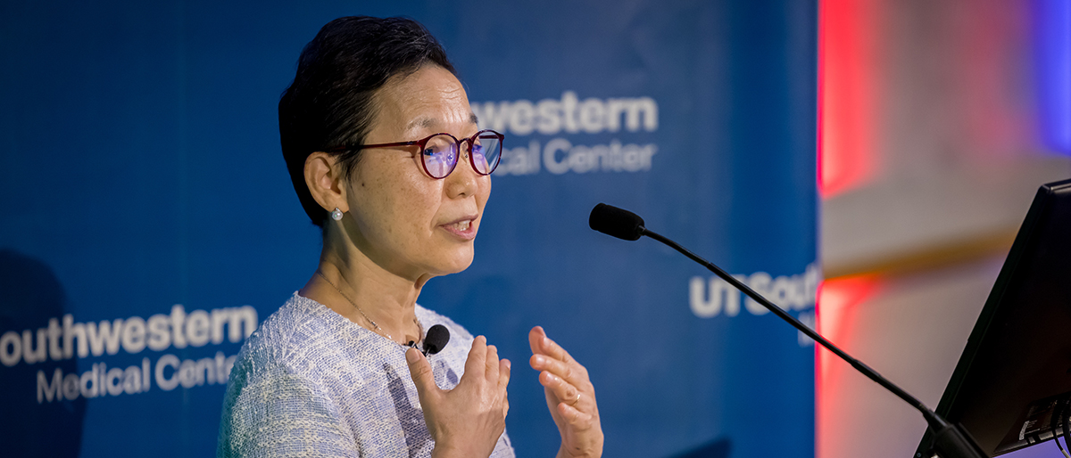 Woman speaks from UTSW podium.