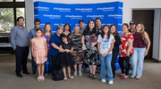 Family members stand proudly beside Ms. Olivares with her award following the program.