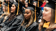 Master of Physician Assistant Studies graduates wait patiently in their seats for their turns to walk across the stage.