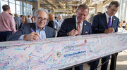 From left: Dr. Podolsky, John M. Zerwas, M.D., Chancellor of the University of Texas System, and Brian Dean, M.B.A., M.P.H., UT System Executive Vice Chancellor for Health Affairs, sign a beam headed to the hospital.