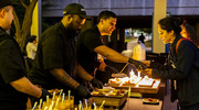 During the reception that took place on the Eugene McDermott Plaza, caterers from the Auxiliary Restaurant Group dish out delicious bites.