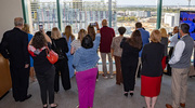 Event attendees view progress of the New Pediatric Campus from a building window on UT&nbsp;Southwestern’s North Campus.