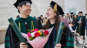 Alexander Wu, M.D., left, and Sumin Son, M.D., M.P.H., celebrate their graduation together.