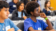 Natnale Mitike, a Harmony Science Academy student, listens to a lecture before shaping Play-Doh into a 3D-printed “bone.” The hands-on activity enabled students to learn about anatomy, biomaterials, and tissue engineering in the context of a specific case vignette, Dr. Tatara said.