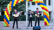 Mariachi Arraigo de America excites the crowd with mariachi music.