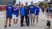 UT Southwestern leaders Holly Crawford (second from left), Susan Hernandez, D.N.P., M.B.A., RN (third from left), Vice President and Health System Chief Nurse Executive, and Jeremy Falke, M.B.A. (second from right), Vice President and Chief Human Resources Officer, pose with their significant others and furry friends.