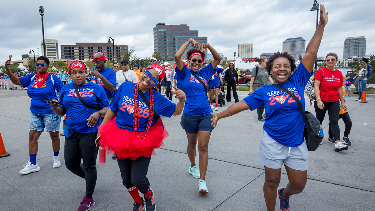 Walkers in the 2025 Heart Walk dancing for the camera.