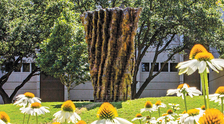 Large bronze statue carved to look like wood.