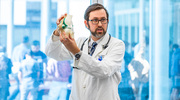 Dr. Tatara demonstrates anatomy on a model knee.