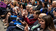 Guests applaud the award recipients as they walk across the stage to accept their awards. The event was also livestreamed so others could watch the ceremony virtually.