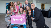 Building connections and celebrating fellow employees who strengthen the UTSW culture, a group attending the Business Affairs event enjoys cool treats.